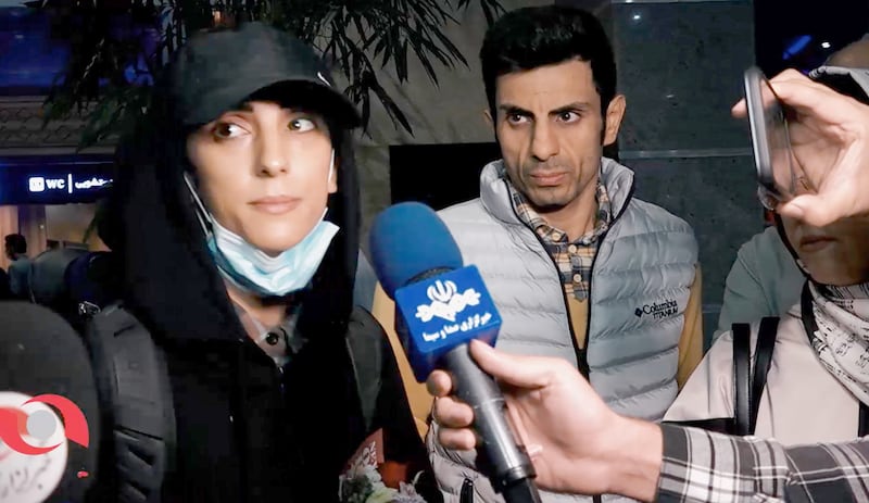 Iranian climber Elnaz Rekabi arrives at the Imam Khomeini International Airport in Tehran after competing in South Korea without wearing a mandatory headscarf. Rekabi said the act was unintentional as she rushed to prepare for competition and apologised. EPA