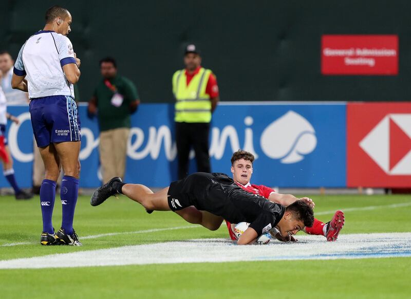 Dubai, United Arab Emirates - December 05, 2019: Tone Ng Shiu of New Zealand scores during the game between New Zealand and Wales in the mens section of the HSBC rugby sevens series 2020. Thursday, December 5th, 2019. The Sevens, Dubai. Chris Whiteoak / The National