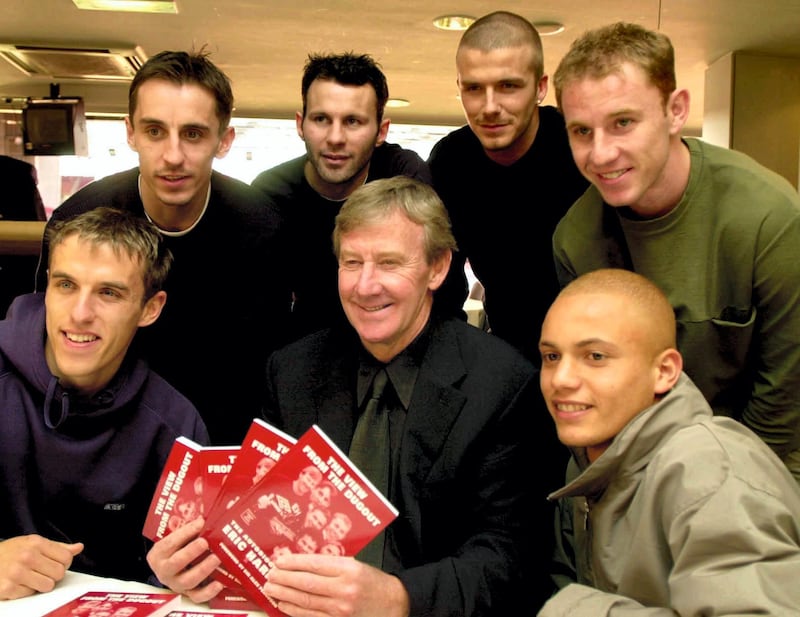 File photo dated 01-03-2001 of Eric Harrison (centre) with Manchester United players (from left) Gary Neville, Phil Neville, Ryan Giggs, David Beckham, Nicky Butt and Wes Brown during his book launch, at Old Trafford.