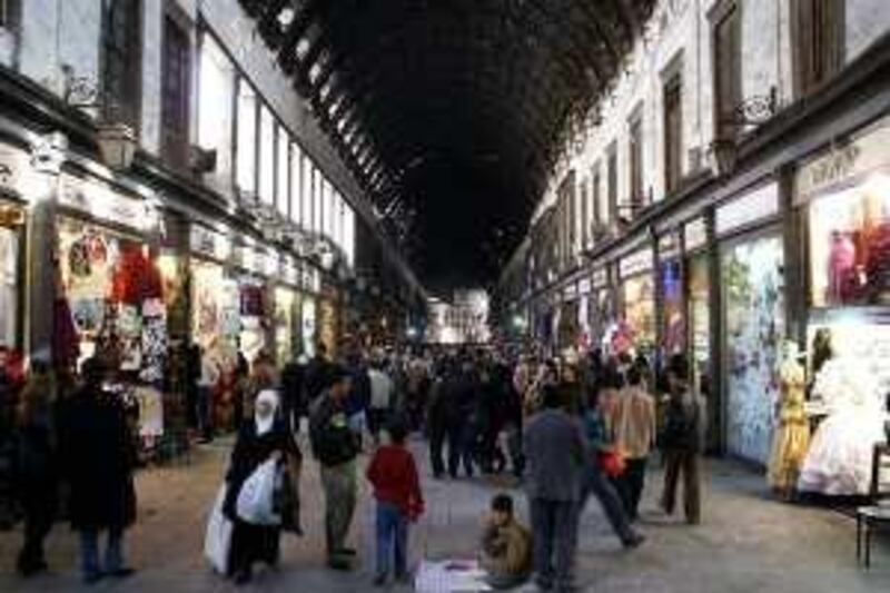 People shop at the ancient Hamidiyeh market in Damascus, Syria, Saturday, Dec. 27, 2008. Development spurred by a shift toward a free market economy is threatening the old quarter of Damascus as aggressive investors flush with cash have pushed property prices so high that more and more homeowners are selling their homes and moving out.  (AP Photo/Ola al Rifai) *** Local Caption ***  BEI505_Syria_Saving_The_Old_City.jpg