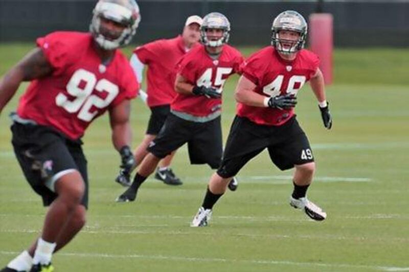 Joe Holland, right, and the rest of the Tampa Bay Buccaneers' rookies who got through mini-camp in May return with the veterans to prepare for the upcoming 2013/14 season.