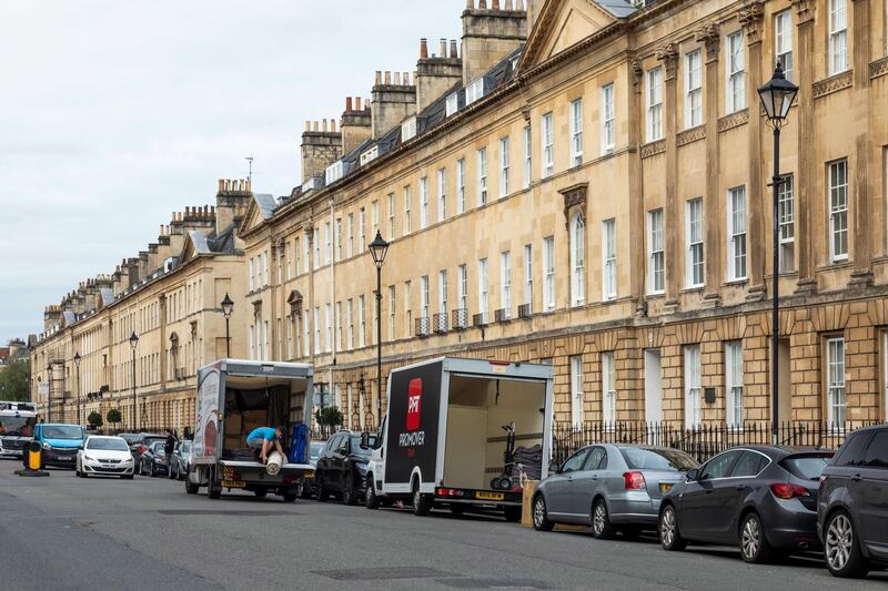 2CNF52C Removal vans in Great Pulteney Street, City of Bath, Somerset, England, UK