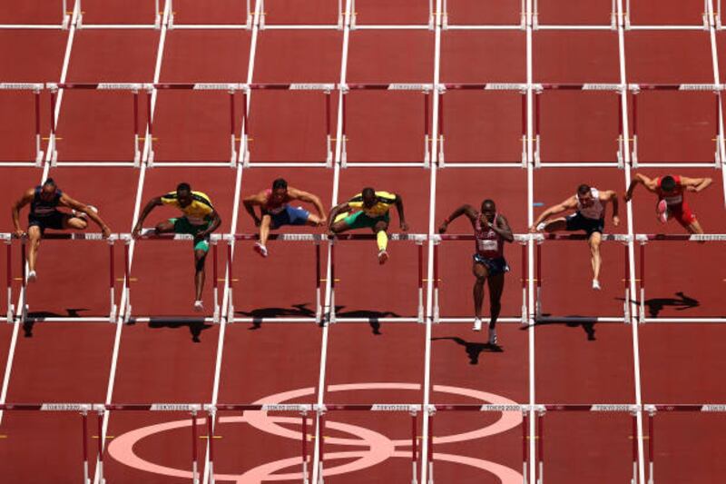 Hansle Parchment of Team Jamaica and Grant Holloway of Team United States lead during the Men's 110m Hurdles Final.