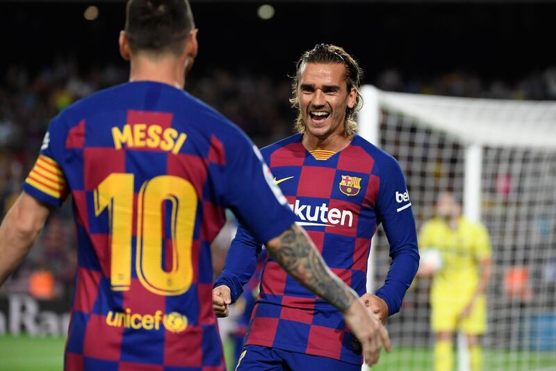 Barcelona's French forward Antoine Griezmann is congratulated by teammate Lionel Messi after scoring the first goal against Villarreal. AFP