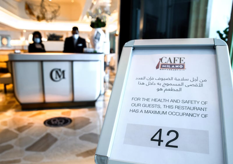 Abu Dhabi, United Arab Emirates, June 15, 2020.    Maximum occupancy sign at the reception of the Cafe Milano at the Four Seasons Hotel, Abu Dhabi.Victor Besa  / The NationalSection:  IfReporter:  Janice Rodrigues