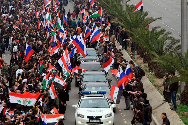 Supporters of Syrian President Bashar al-Assad gather on a Damascus street, to welcome Russian Foreign Minister Sergei Lavrov, February 7, 2012, in this handout photograph released by Syria's national news agency SANA. Lavrov began talks with Syrian President Bashar al-Assad on Tuesday by saying Moscow wants Arab peoples to live in peace and the Syrian leader is aware of his responsibility, Russian news agency RIA reported. REUTERS/SANA (SYRIA - Tags: POLITICS) FOR EDITORIAL USE ONLY. NOT FOR SALE FOR MARKETING OR ADVERTISING CAMPAIGNS. THIS IMAGE HAS BEEN SUPPLIED BY A THIRD PARTY. IT IS DISTRIBUTED, EXACTLY AS RECEIVED BY REUTERS, AS A SERVICE TO CLIENTS *** Local Caption ***  SYR15_SYRIA-_0207_11.JPG