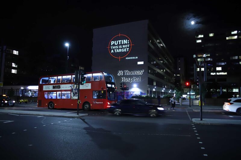 The charity projected messages onto London’s St Thomas’ hospital. Courtesy Help Refugees