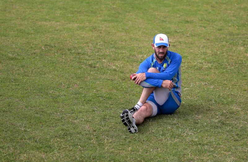 Australian's cricket player Glenn Maxwell stretches during a practice session in Dhaka, Bangladesh, Sunday, Aug. 20, 2017. Australia is scheduled to play two test matches against Bangladesh with the first test beginning Aug. 27 in Dhaka. (AP Photo/A.M. Ahad)