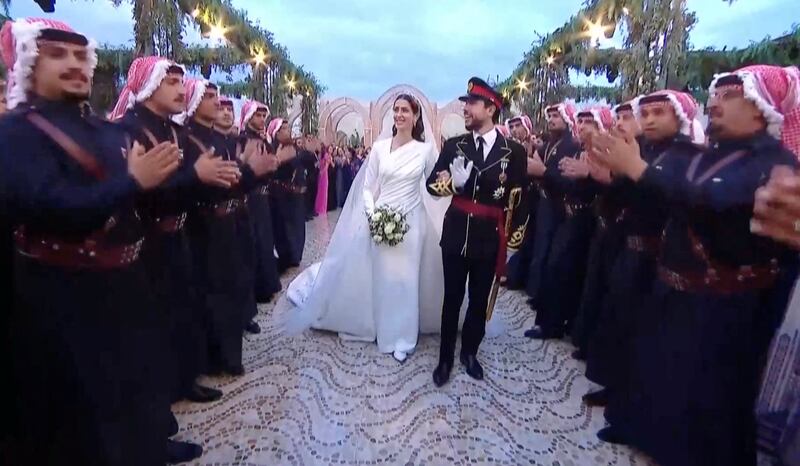 Applause for Prince Hussein and his wife at Al Husseiniya Palace. Reuters