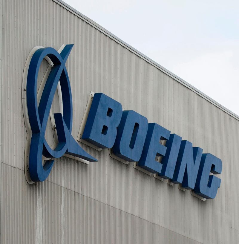  (FILES) In this file photo taken on March 12, 2019 the Boeing logo is pictured at the Boeing Renton Factory in Renton, Washington.  US aviation regulators criticized Boeing on October 18, 2019, for not immediately disclosing communications between two employees with "concerning" information on the investigation of the 737 MAX. / AFP / Jason Redmond
