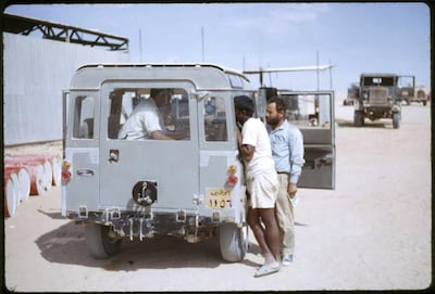 Jebel Dhana, Abu Dhabi 1963 
Mobile banking 1963 style! The British Bank of the Middle East (BBME), Abu Dhabi town branch offered a fortnightly banking service to the various construction sites/oil camps both on the Abu Dhabi mainland and Das Island, the centre for the offshore based Oil Company. The photo shows the expatriate workers buying bank drafts to send money home to their families in India, Pakistan and many of the Arab countries. Photo by David Riley