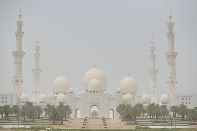 Sheikh Zayed Grand Mosque in Abu Dhabi is shrouded on Monday as dusty conditions linger on. Khushnum Bhandari / The National