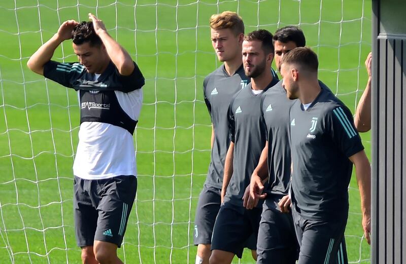 Juventus' Cristiano Ronaldo, left, with team mates during training. Reuters