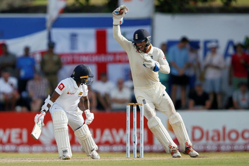 England's wicketkeeper Ben Foakes celebrates after taking a catch to dismiss Sri Lanka's Akila Dananjaya. Reuters