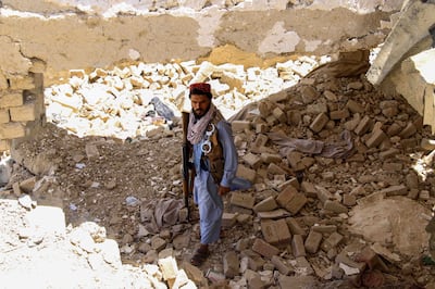 A Taliban member inspects the scene after they destroyed an alleged ISIS explosives depot in Parwan, Afghanistan. EPA