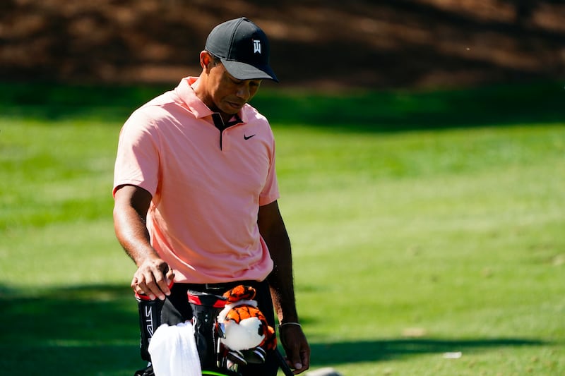 Tiger Woods pauses while hitting on the driving range at Augusta National Golf Club. AP