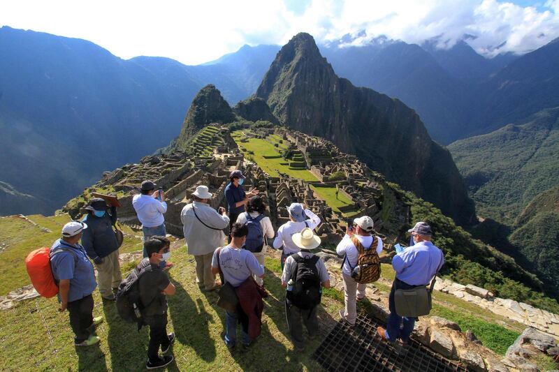 Members of a commission of authorities and experts led by the the Governor of Cusco, Jean Paul Benavente, visit the Inca citadel of Machu Picchu, assessing the new health and distancing protocols in order to reopen to the public on July 1.  AFP