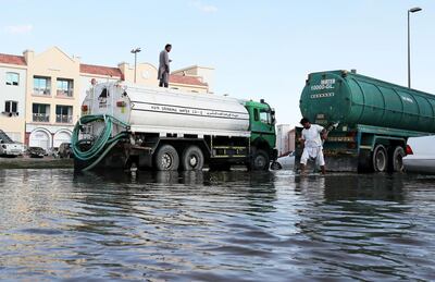 DUBAI, UNITED ARAB EMIRATES, Jan 15 – 2020 :-  Water logged streets because of rain for the last few days at the International City in Dubai. Water tankers pumping out the accumulated water from the roads and residential area at the International City. (Pawan Singh / The National) For News/Online/Instagram