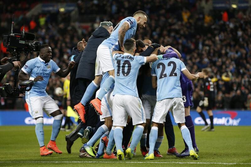 Manchester City’s Yaya Toure celebrates scoring during the penalty shoot-out with teammates. Action Images via Reuters / Paul Childs