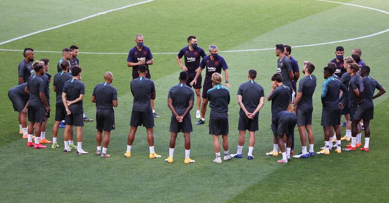 Quique Setien talks to the players during a training session ahead of Barcelona's Champions League quarter-final against Bayern Munich. Reuters