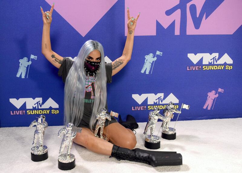 UNSPECIFIED - AUGUST 2020: (EDITORS NOTE: This image has been digitally altered.) Lady Gaga poses with her awards during the 2020 MTV Video Music Awards, broadcast on Sunday, August 30th 2020. (Photo by Kevin Winter/MTV VMAs 2020/Getty Images for MTV)