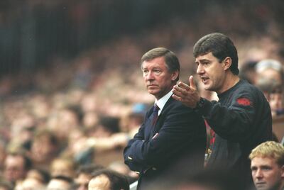 14 Oct 1995:  Manchester United Manager Alex Ferguson and Coach Brian Kidd discuss tactics during an FA Carling Premiership match against Manchester City at Old Trafford in Manchester, England. Manchester United won the match 1-0. \ Mandatory Credit: MarkThompson/Allsport