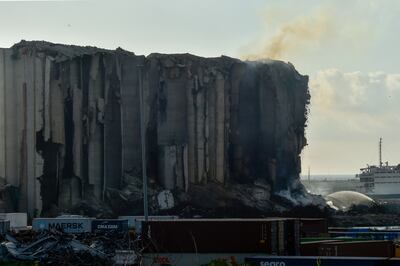 Firefighters try to extinguish a blaze at silos in the port of Beirut, Lebanon, on Thursday. EPA