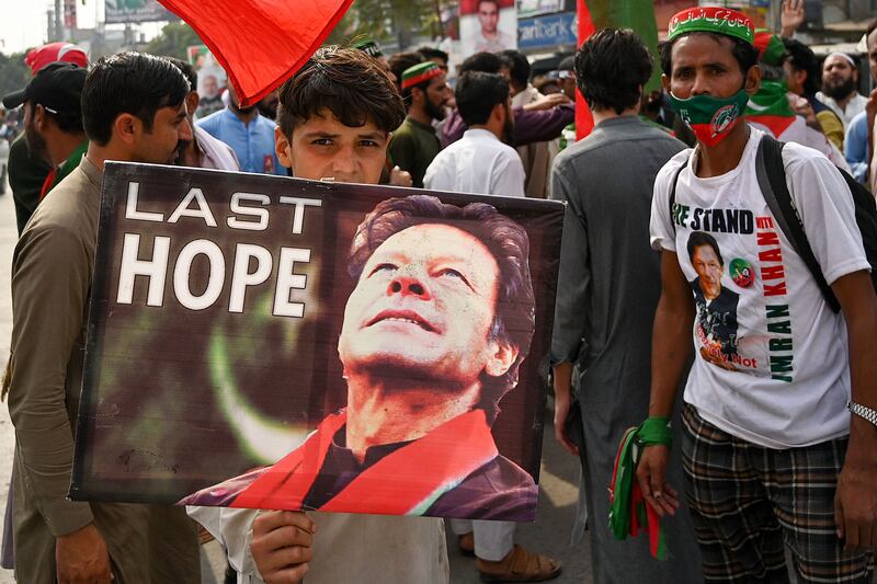 Imran Khan supporters protest at the cordoned-off site of the assassination attempt in Wazirabad. AFP