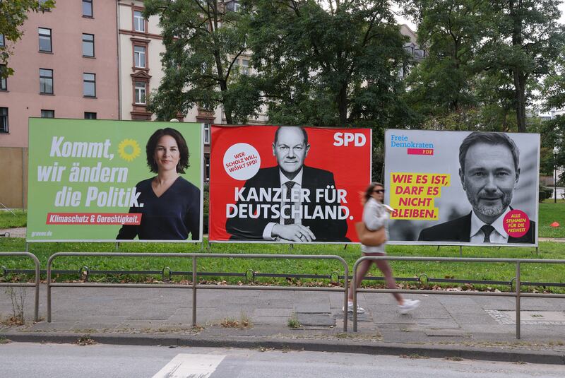 Election billboards showing the Greens' Annalena Baerbock,  the Social Democrats' Olaf Scholz and Christian Lindner, lead candidate of the German Free Democrats, in Frankfurt. Photo: Getty