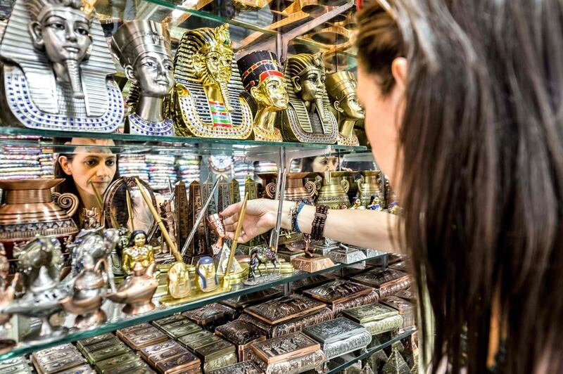 A tourist shops at the Khan Al Khalili market in Cairo on May 20, 2016. AFP