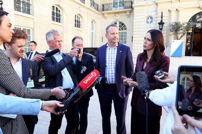 New Zealand Prime Minister Jacinda Ardern, right, gives a press conference, at the OECD headquarters, in Paris, Tuesday, May 14, 2019. The leaders of France and New Zealand will make a joint push to eliminate acts of violent extremism from being shown online, in a meeting with tech leaders in Paris on Wednesday. (AP Photo/Thibault Camus)