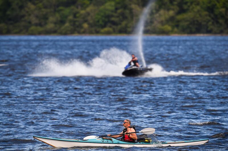 A man takes to the water in a canoe in Loch Lomond, Scotland, as restrictions ease. Getty Images