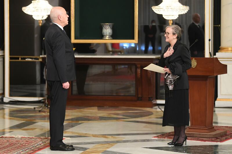 Mr Saied talks to Prime Minister Najla Bouden during the swearing-in of the new government. Photo: Tunisian Presidency via AP