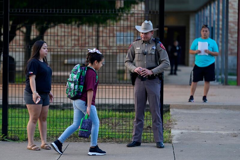 A 2.4-metre-tall fence surrounds Uvalde Elementary School. AP