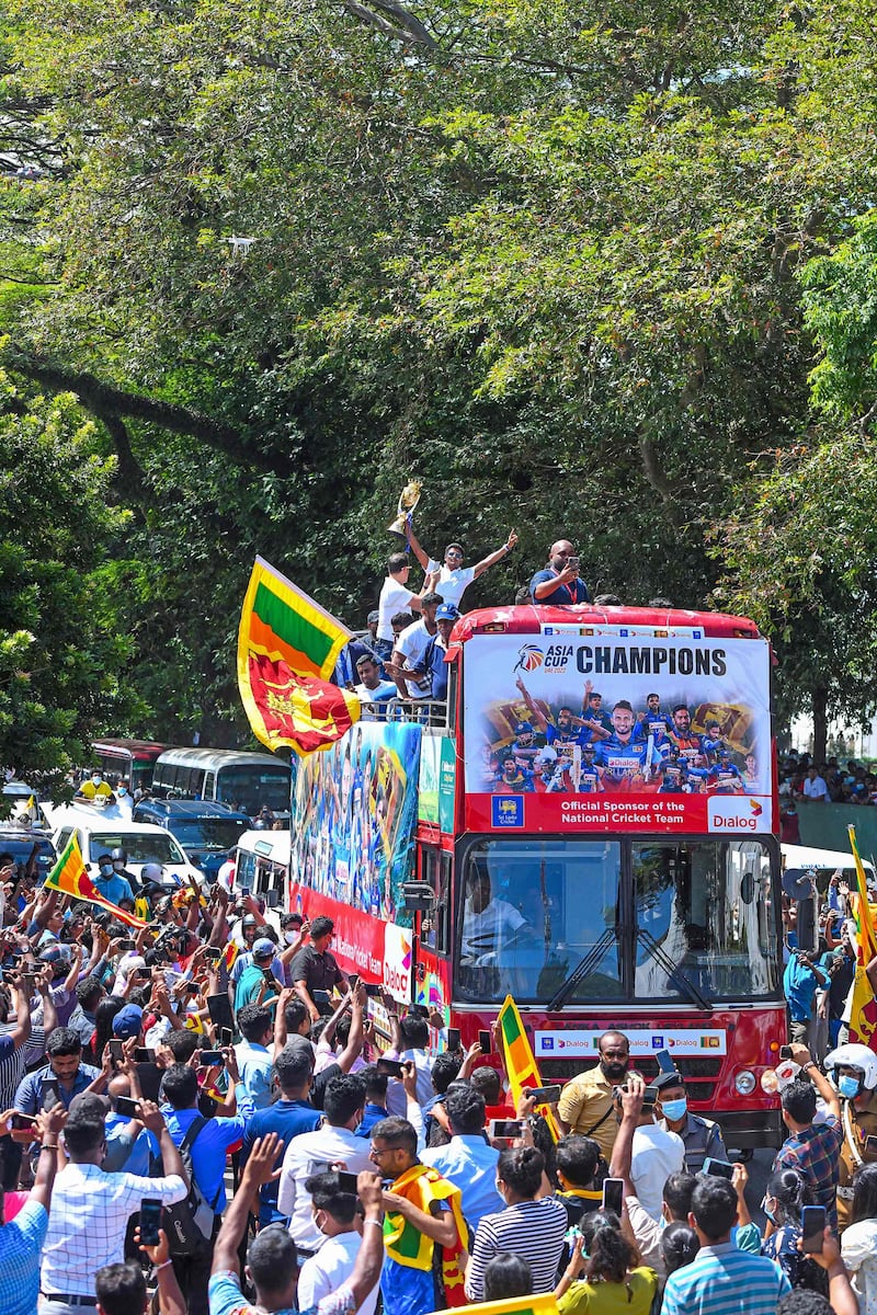 Sri Lankan players during their victory parade in Colombo. AFP