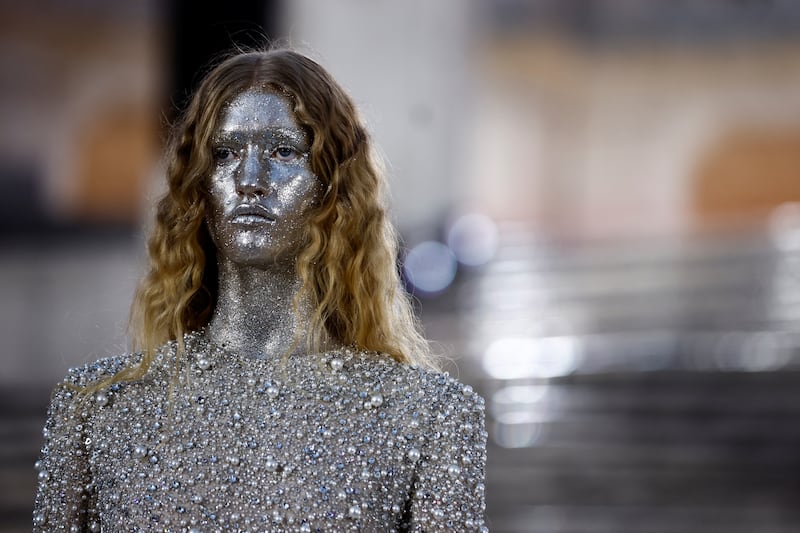 Elsewhere at Valentino, models had faces and necks completely covered in glitter. Reuters 