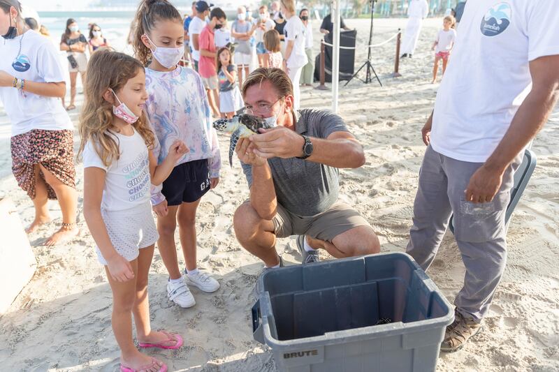 Young children were among the crowd that gathered to watch the turtle being released.