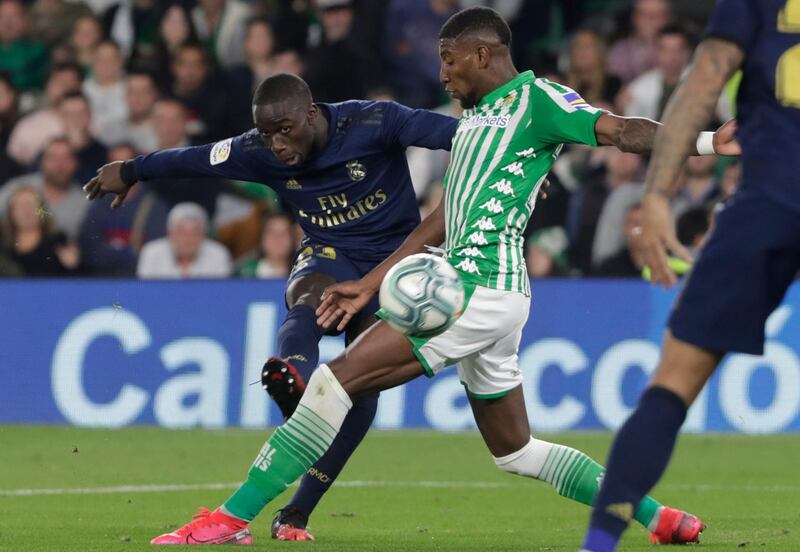 Real Madrid defender Ferland Mendy fights for the ball against Betis' Emerson. AP Photo