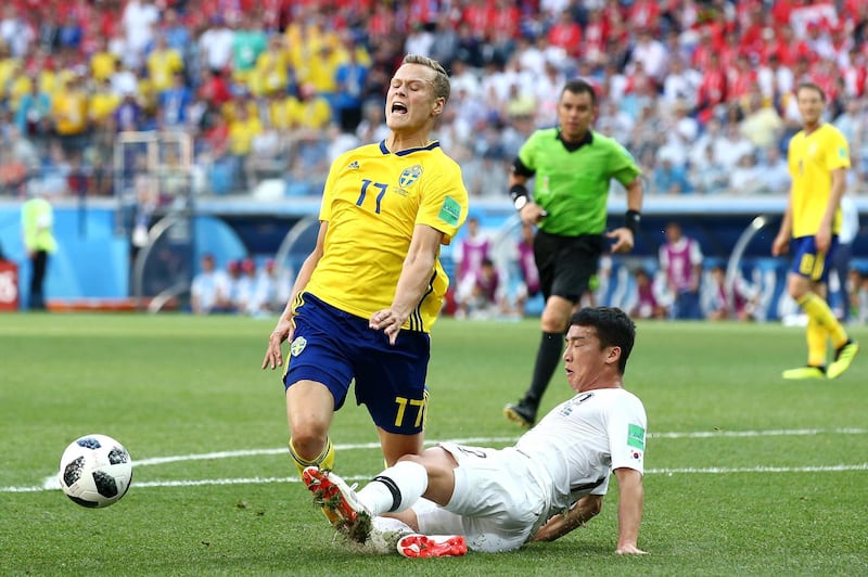 Kim Min-Woo fouls Viktor Claesson to award Sweden a VAR-led penalty. Jan Kruger / Getty Images