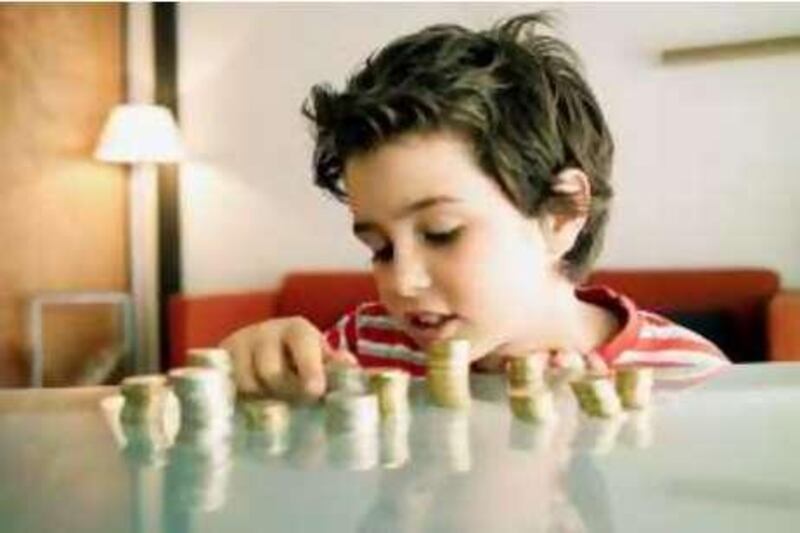 November, 2008-stock photo of child counting money 
 Llu’s Real/Grapheast