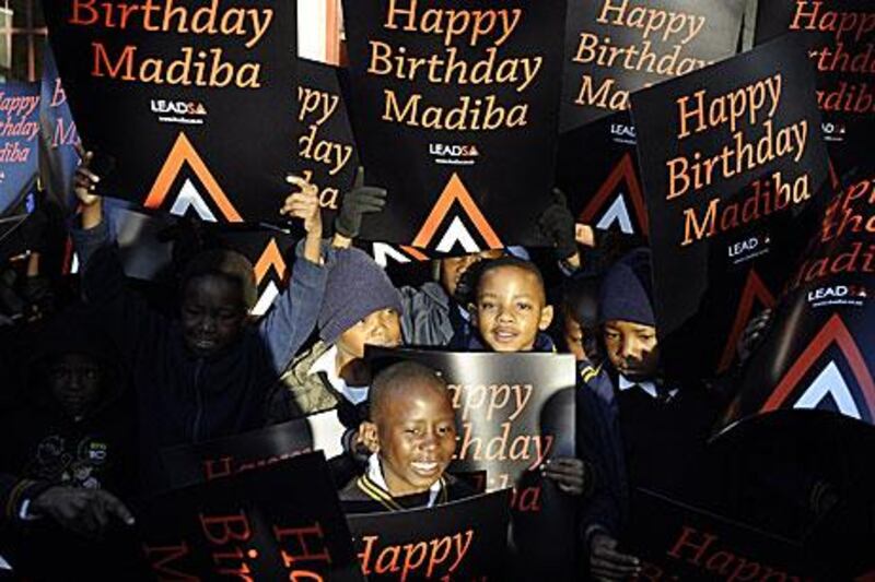 South African schoolchildren get ready to sing Happy Birthday to Nelson Mandela at a school in Soweto, Johannesburg.