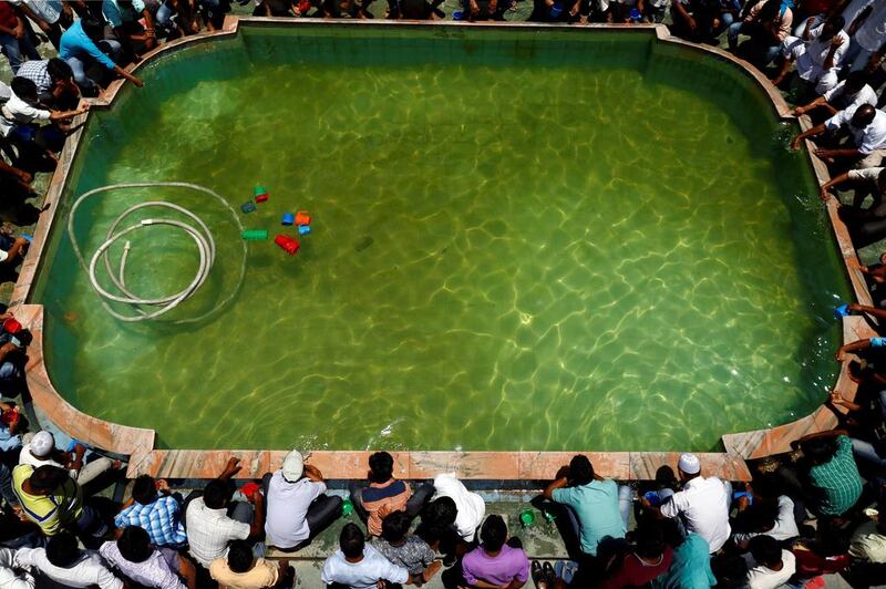 Nepalese Muslims wash themselves upon their arrival for the prayers during Ramadan in Kathmandu, Nepal. Navesh Chitrakar / Reuters