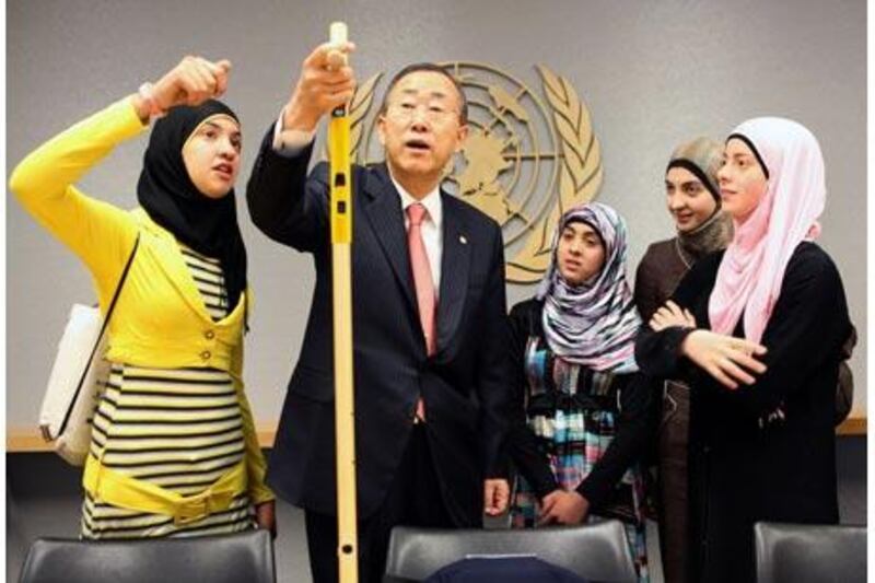 The UN secretary general, Ban Ki-moon, is impressed by the walking stick with infrared sensors invented by three Palestinian schoolgirls. Michael Falco for The National