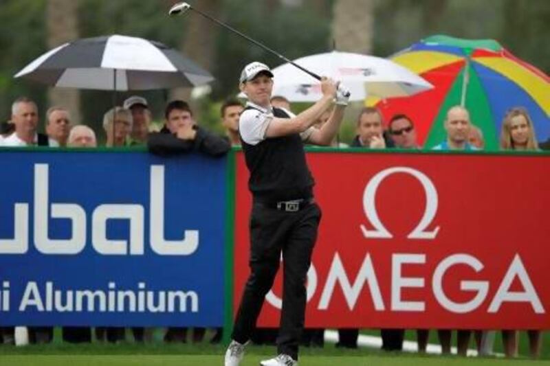 Stephen Gallacher tees off on the first hole during third round of the Dubai Desert Classic Golf.