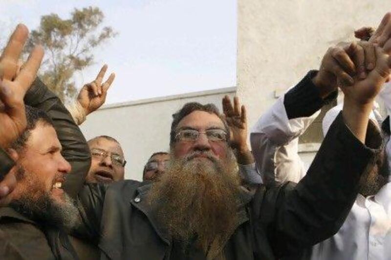 Abboud El Zomor, centre, is released from Tora Prison on March 12. He spent 30 years in jail for planning to overthrow the Anwar Sadat government.