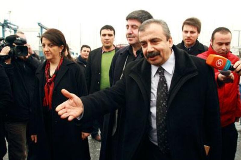 Pro-Kurdish politicians Sirri Sureyya Onder, right, Pelvin Buldan, left, and Altan Tan, centre, before meeting the imprisoned Kurdistan Workers' Party leader, Abdullah Ocalan. Reuters