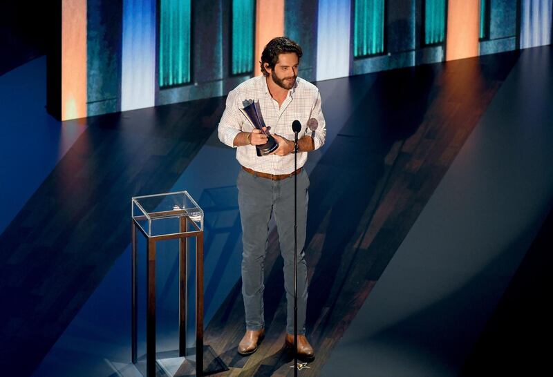 NASHVILLE, TENNESSEE - SEPTEMBER 16: Thomas Rhett poses with the Entertainer of the Year award onstage during the 55th Academy of Country Music Awards at the Grand Ole Opry on September 16, 2020 in Nashville, Tennessee. The ACM Awards airs on September 16, 2020 with some live and some prerecorded segments.   Jason Kempin/Getty Images for ACM/AFP