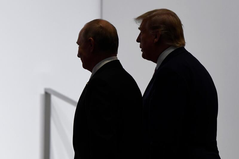 FILE - In this June 28, 2019, file photo, President Donald Trump and Russian President Vladimir Putin walk to participate in a group photo at the G20 summit in Osaka, Japan. The Trump administration is notifying international partners that it is pulling out of a treaty that permits 30-plus nations to conduct unarmed, observation flights over each otherâ€™s territory â€” overflights set up decades ago to promote trust and avert conflict. The administration says it wants out of the Open Skies Treaty because Russia is violating the pact and imagery collected during the flights can be obtained quickly at less cost from U.S. or commercial satellites. (AP Photo/Susan Walsh, File)