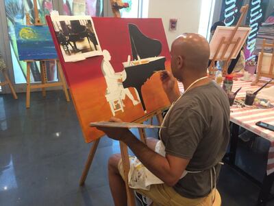 Sunil Gomes, a chief executive who has been taking regular art classes for three years, works on his painting at Soul Art Centre. Courtesy Soul Art Centre