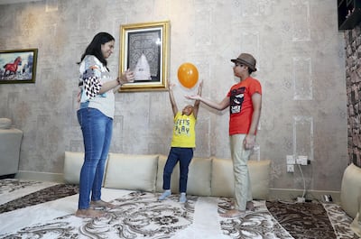SHARJAH, UNITED ARAB EMIRATES , May 10 – 2020 :- Farheen Matheranwala with her two sons Mohammed Matheranwala (10 years old right side) and Hussain Matheranwala ( 4 years old in the center) at her home in the Beach Tower 2 in Al Khan area in Sharjah. (Pawan Singh / The National) For Business. Story by Keith J Fernandez